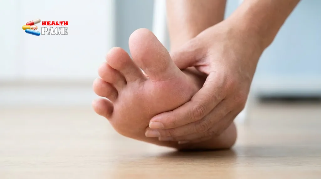 Adult holding their foot near the big toe joint to indicate pain and discomfort.